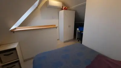 Un ou plusieurs lits dans un hébergement de l'établissement Maison avec Parking, proche Tours