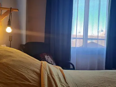 Un ou plusieurs lits dans un hébergement de l'établissement chambre cosy en centre ville avec accès indépendant