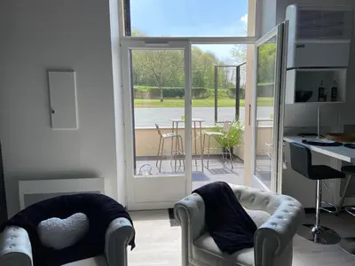 Coin salon dans l'établissement L escapade amoureuse