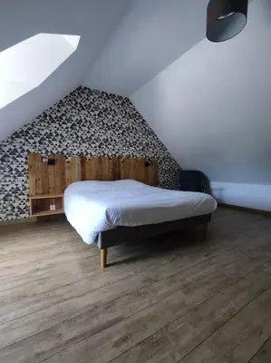 Un ou plusieurs lits dans un hébergement de l'établissement Maison de campagne