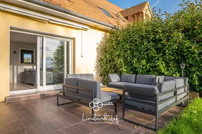 Coin salon dans l'établissement Cœur de Sarthe - Maison 20pers - Balnéo - BBQ