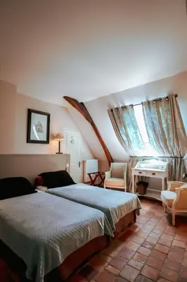 Un ou plusieurs lits dans un hébergement de l'établissement Le Grand Presbytère de Beaulieu