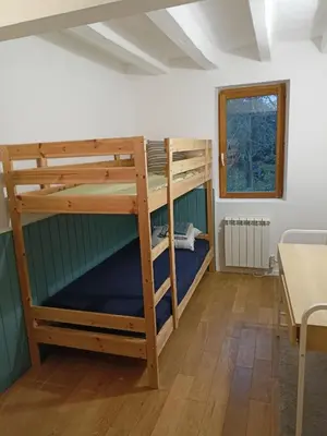 Un ou plusieurs lits dans un hébergement de l'établissement Chambre d'hôte 4 couchages