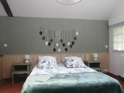 Un ou plusieurs lits dans un hébergement de l'établissement Charmant gîte près d'Angers avec extérieur privé - FR-1-622-93