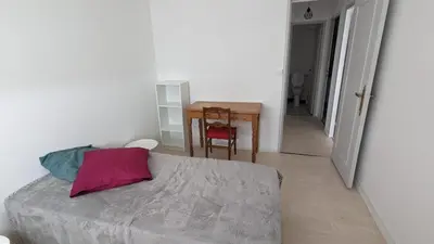 Un ou plusieurs lits dans un hébergement de l'établissement appartement lumineux