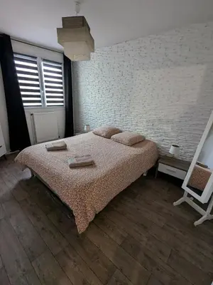 Un ou plusieurs lits dans un hébergement de l'établissement Appartement idéal circuit des 24h du Mans
