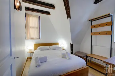 Un ou plusieurs lits dans un hébergement de l'établissement Appartement avec 2 chambres, bureau et wifi fibre