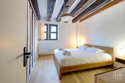 Un ou plusieurs lits dans un hébergement de l'établissement Appartement avec 2 chambres, bureau et wifi fibre