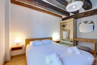 Un ou plusieurs lits dans un hébergement de l'établissement Appartement avec 2 chambres, bureau et wifi fibre