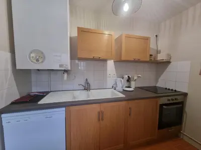 Cuisine ou kitchenette dans l'établissement Appartement au centre de Richelieu