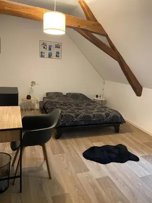 Coin salon dans l'établissement Maison proche circuit le Mans