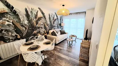 Coin salon dans l'établissement Appartement cosy, balcon et place privée