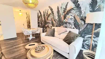 Coin salon dans l'établissement Appartement cosy, balcon et place privée