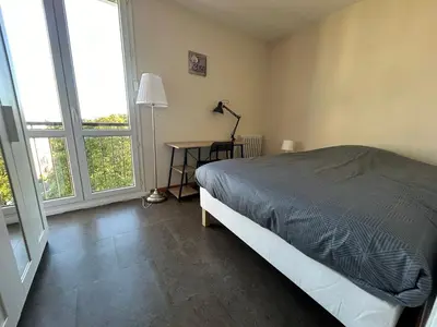 Un ou plusieurs lits dans un hébergement de l'établissement Appartement lumineux 3 chambres à Tours nord