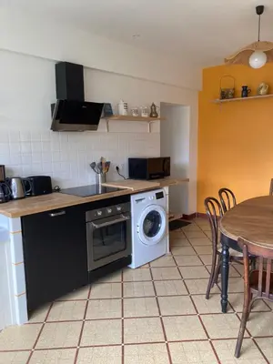 Cuisine ou kitchenette dans l'établissement Le gîte de la Roche