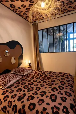 Un ou plusieurs lits dans un hébergement de l'établissement Studio Savane - 5 min du Zoo