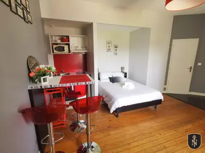 Un ou plusieurs lits dans un hébergement de l'établissement Magnifique appartement entre centre ville et gare - 5