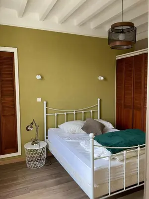 Un ou plusieurs lits dans un hébergement de l'établissement Maison chaleureuse avec grand jardin à 2h de Paris