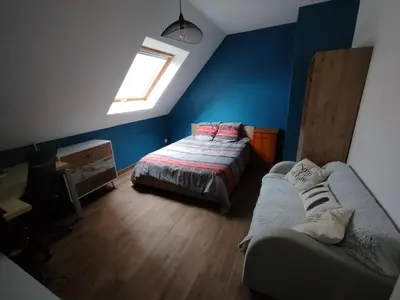 Un ou plusieurs lits dans un hébergement de l'établissement Maison 3 chambres Le Mans
