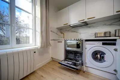Cuisine ou kitchenette dans l'établissement La Suite du Roi Henri