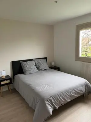 Un ou plusieurs lits dans un hébergement de l'établissement Maison avec jardin proche circuit des 24h