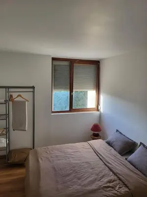 Un ou plusieurs lits dans un hébergement de l'établissement charment appartement au pied de trame