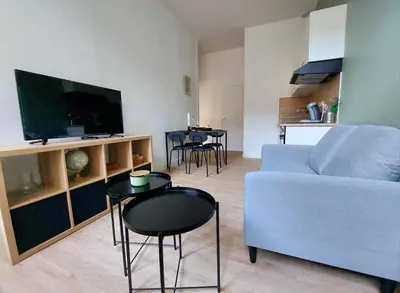 Télévision ou salle de divertissement dans l'établissement L'Urbain