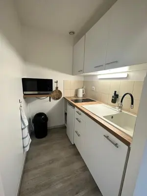 Cuisine ou kitchenette dans l'établissement Appart T3 confort 4-6 pers - CLIM-Hypercentre