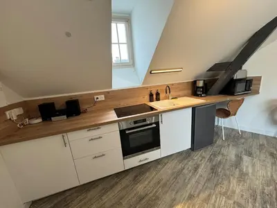 Cuisine ou kitchenette dans l'établissement Appart T2 cosy - 4 pers - Centre Baugé