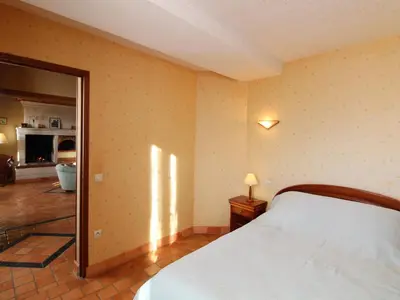 Un ou plusieurs lits dans un hébergement de l'établissement Gîte Anjou familial avec cheminée, climatisation, WIFI - FR-1-622-95