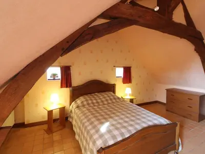 Un ou plusieurs lits dans un hébergement de l'établissement Gîte Anjou familial avec cheminée, climatisation, WIFI - FR-1-622-95