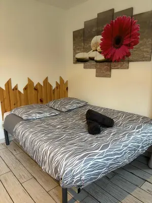 Un ou plusieurs lits dans un hébergement de l'établissement Gîte à la campagne 1