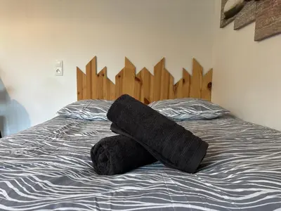 Un ou plusieurs lits dans un hébergement de l'établissement Gîte à la campagne 1