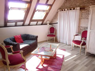 Coin salon dans l'établissement Le Plessis, Stone Farmhouse Loft with Gardens and Pool
