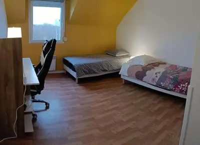 Un ou plusieurs lits dans un hébergement de l'établissement Maison de 82m2 proche du Mans avec parking privé