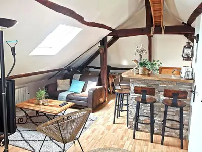 Coin salon dans l'établissement Deux pièces sous les toits
