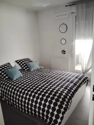 Un ou plusieurs lits dans un hébergement de l'établissement Charmant appartement 2 chambres - Proche Tours