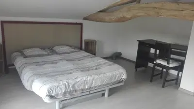 Un ou plusieurs lits dans un hébergement de l'établissement Maison rénovée en tuffeau