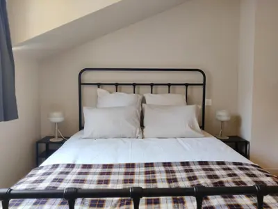 Un ou plusieurs lits dans un hébergement de l'établissement Maison de Charme & Cour Privée dans le Cœur Historique d'Amboise