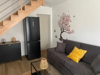 Coin salon dans l'établissement Duplex l Auvetia 150 m circuit 24 h