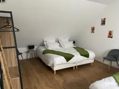 Un ou plusieurs lits dans un hébergement de l'établissement Duplex l Auvetia 150 m circuit 24 h