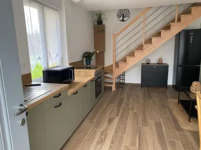 Cuisine ou kitchenette dans l'établissement Duplex l Auvetia 150 m circuit 24 h