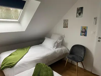 Un ou plusieurs lits dans un hébergement de l'établissement Duplex l Auvetia 150 m circuit 24 h