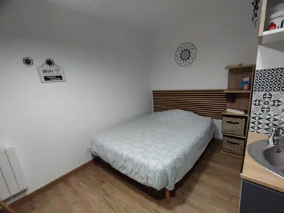 Un ou plusieurs lits dans un hébergement de l'établissement La room