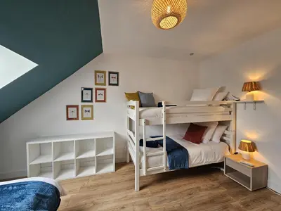 Un ou plusieurs lits dans un hébergement de l'établissement Gîte du Magnolia