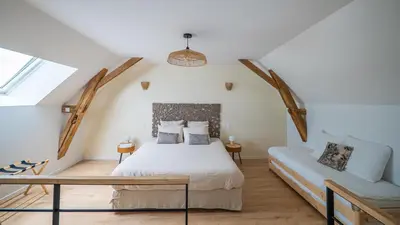 Un ou plusieurs lits dans un hébergement de l'établissement La Grange Clyna - Love Room