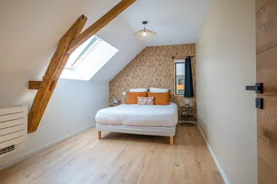 Un ou plusieurs lits dans un hébergement de l'établissement La Grange Clyna - Love Room