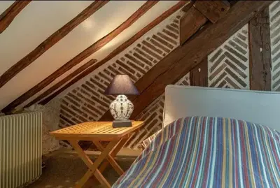 Un ou plusieurs lits dans un hébergement de l'établissement Maison avec jardin à Cellettes, 150 m², local à vélos