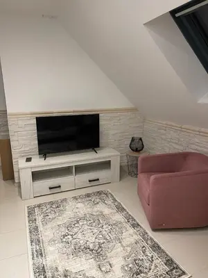 Télévision ou salle de divertissement dans l'établissement La Maison de Cristina Michael