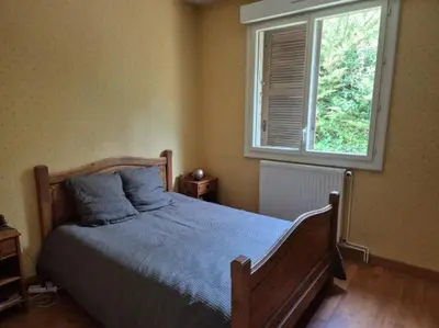 Un ou plusieurs lits dans un hébergement de l'établissement L'ébène - Chez L'habitant